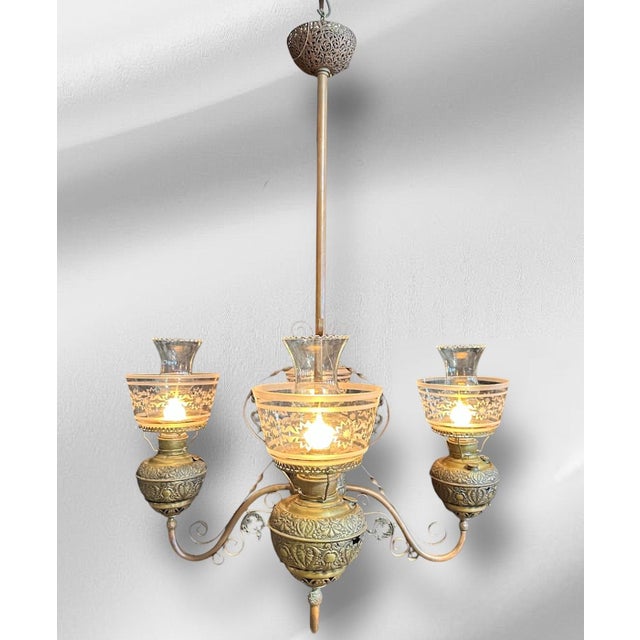This stunning chandelier is an excellent example of early American history! Manufactured by the Miller Lamp company, a...
