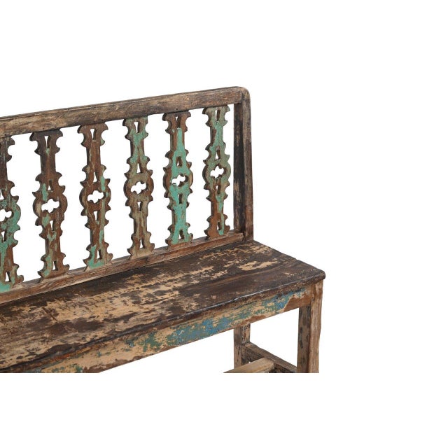 This Vintage Indian Painted Teakwood Bench is constructed from solid teakwood, featuring an intricately carved openwork...
