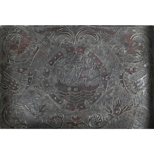 Antique possibly 19th century tooled leather over wood tray. Highly detailed with sailing ship, creatures, birds, dragons....