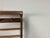 Rare Mid-Century Modern wall-mounted coat rack, dating from approximately the 1950s–1960s, featuring a beautifully...