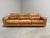 Remarks: Mid century lounge sofa by De Sede. Design by Robert Haussmann, Switzerland 1970s. Wooden frame with cognac...