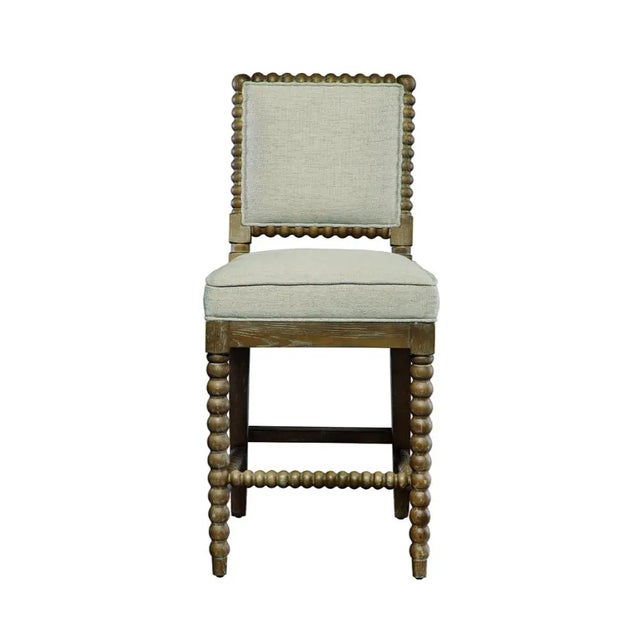 The BOGOS Sara Counter Stool combines distinctive bobbin-turned legs with a clean, upholstered seat for practical dining...