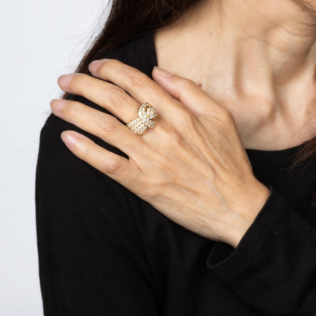 Stylish vintage pave diamond ring crafted in 18 karat yellow gold (circa 1980s). Round brilliant cut diamonds total an...