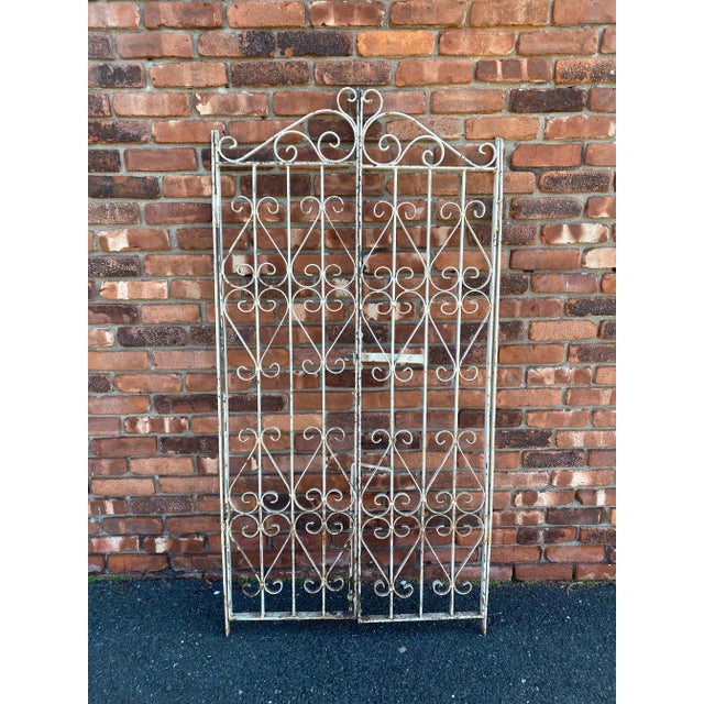 Vintage solid Iron 2 panel gate from the Brittany Region of France. Ready to hang, each panel has the side piece attached...