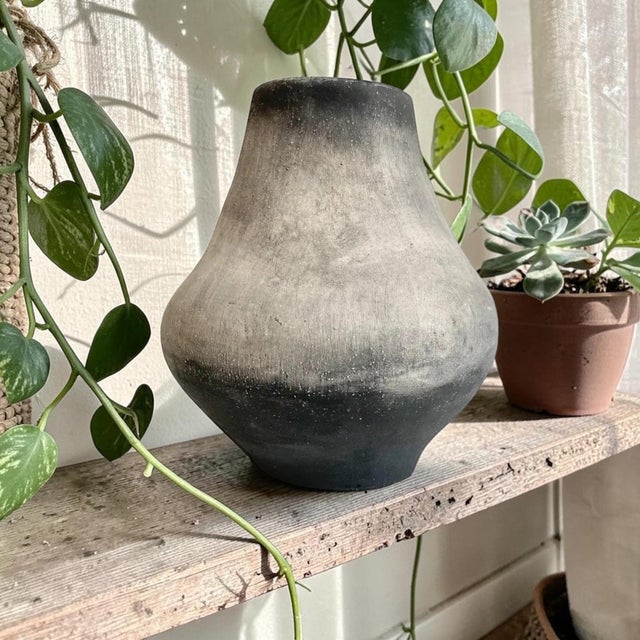 Elevate your home decor with the Signed Wabi Sabi Ceramic Bulb Vase, a stunning blend of artistry and minimalism. Crafted...