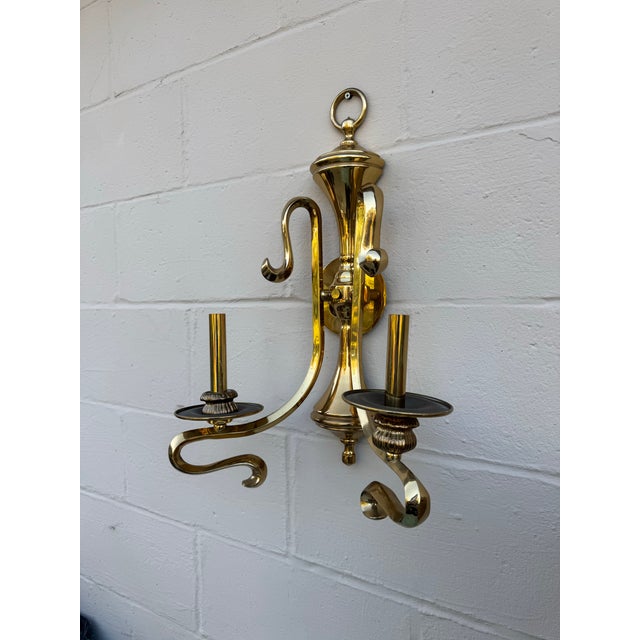 Elegant Mid-Century Brass Double-Arm Wall Sconce, 1950s–1970s Dimensions: 14.5” W × 21” H × 7” D This refined Mid-Century...