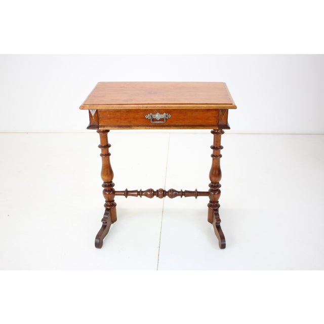 Made of wood. Good condition. Wear consistent with age and use.