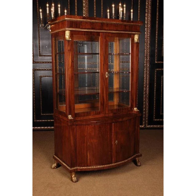 High-quality Cuba mahogany on solid softwood. Architecturally articulated body. Two-door, bent frame box on pressed,...