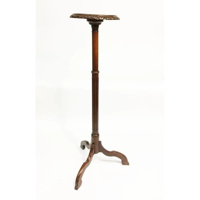 19th century Dutch mahogany torchère or plant stand A mahogany tripod torchère or plant stand with round top measures 23...