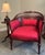 Elegant Edwardian mahogany barrel back conversation chair dating to approximately 1900–1910. The frame features a carved...