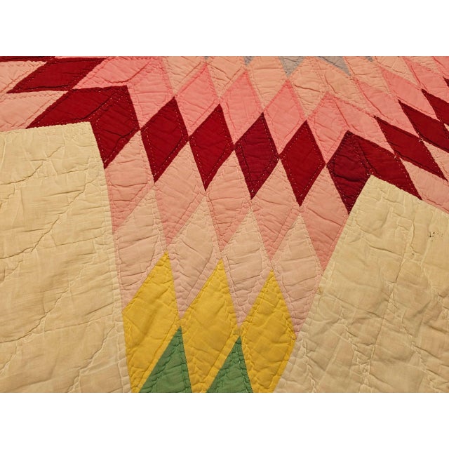 An exquisite early 20th-century Lone Star quilt, entirely hand-stitched and hand-quilted, showcasing a radiant central...