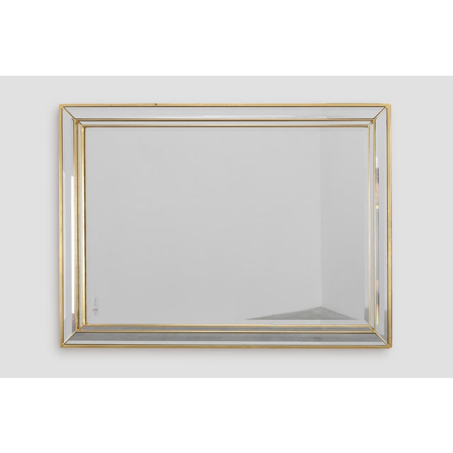 This 20th‑century Hollywood Regency mirror by Deknudt combines glamorous decorative flair with the clean precision of...