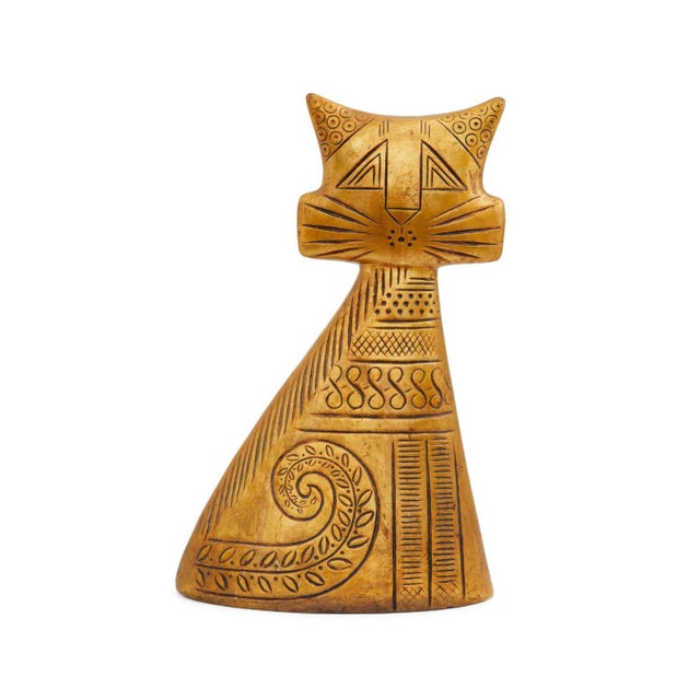 Whether you're a mid-century modern enthusiast or simply love quirky, unique decor, this Turnabout Cat is a collectible...