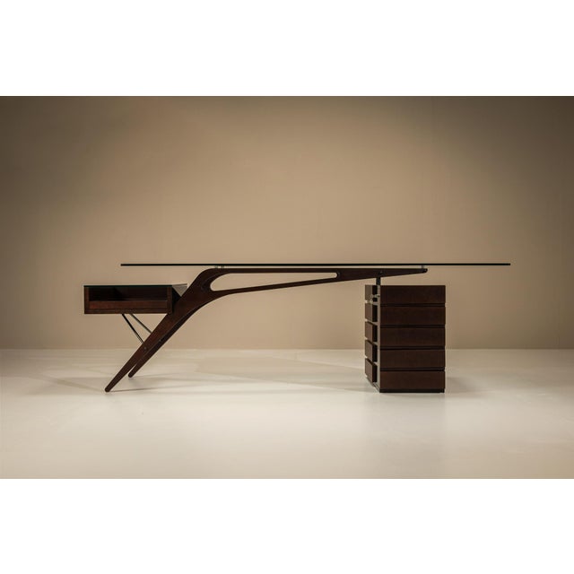 This “Cavour” desk was designed by Carlo Mollino in 1949 and later reissued by Italian manufacturer Zanotta. Its open...