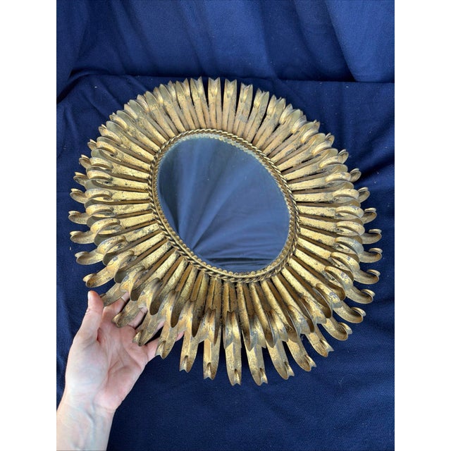 Circa the 1960s, surely Italian. Tole construction with a roughly applied gold finish, some added patina enhancing its...
