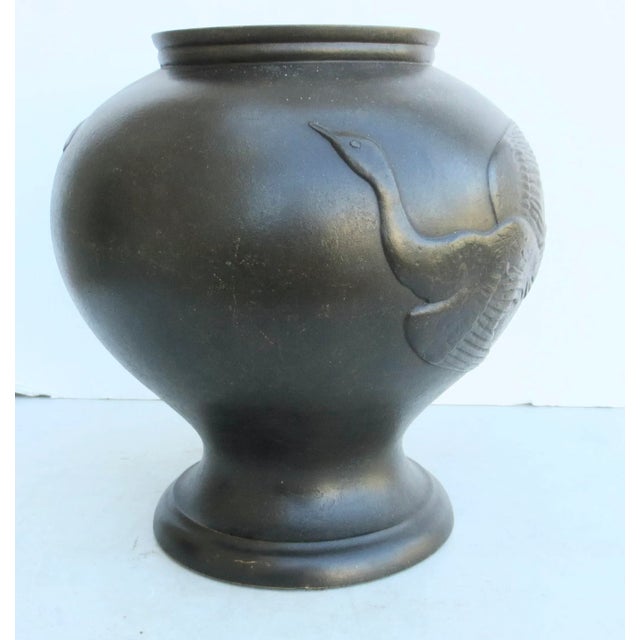 Globular bronze vase with two flying duck designs on the surface. Meiji Japanese nature-inspired design on the surface...