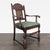 Carved wood chair with upholstered seat. Dimensions (in): 26W x 19D x 40H.