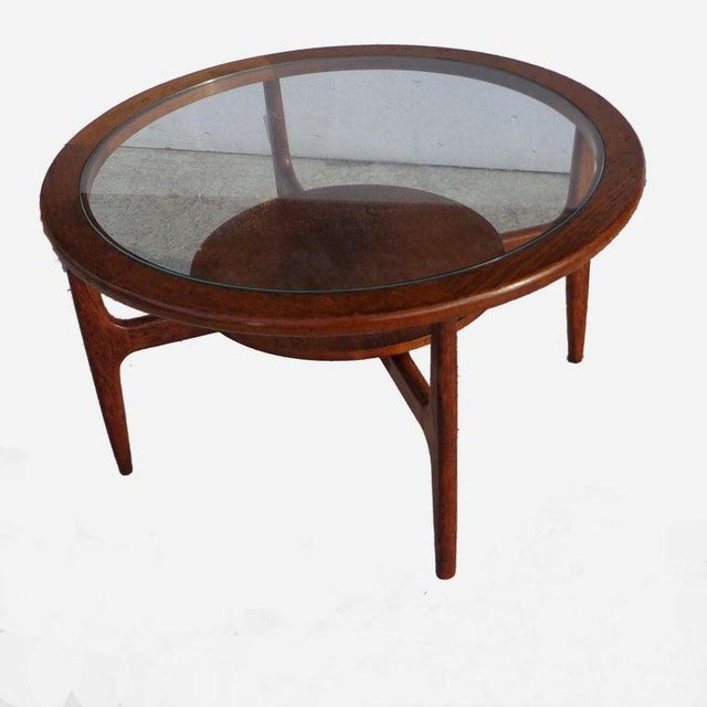 Mid century 2-tier coffee table Walnut with 2 levels for storage. Tapered legs. 32"W x 32"D x 18"H.