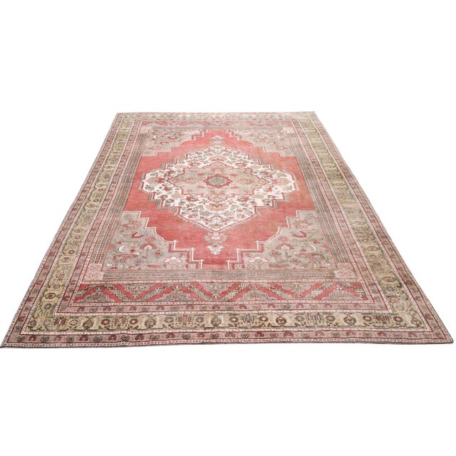 Vintage Turkish Oushak Hand-knotted with care using traditional rug-making techniques, this wool rug blends timeless...