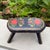 Captivating hand painted wooden footstool with heart and floral decoration. Signed on the underside “Build and Painted by...