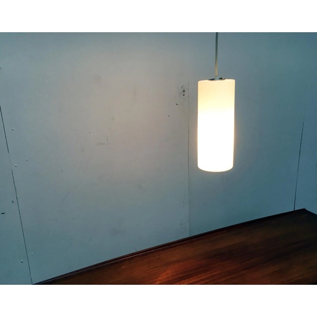 Glass pendant lamps from the renowned house Glashütte Limburg. Simple pendant made of glass. The body of the lamp consists...