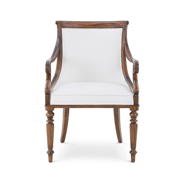 Blending 19th-century neoclassical elegance with artisan craftsmanship. This hand-carved mahogany scoop-back chair...