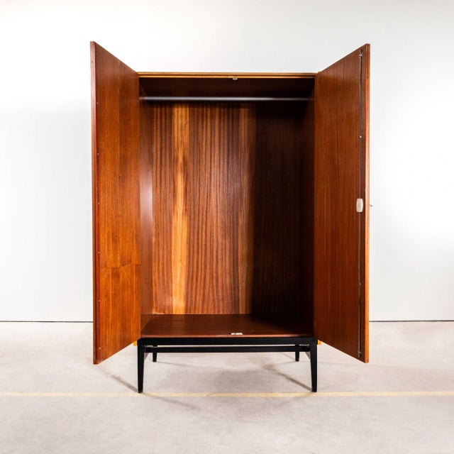 : 1960’s glossy mid-century cupboard with ebonised legs. Beautiful simple and classic mid century wardrobe sourced in the...