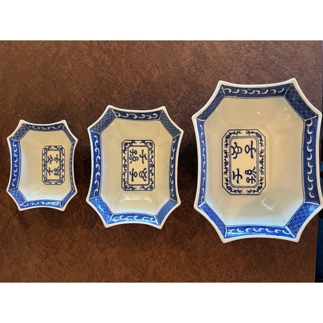 Enhance your table setting with this beautiful set of three vintage blue and white porcelain serving dishes. Featuring...