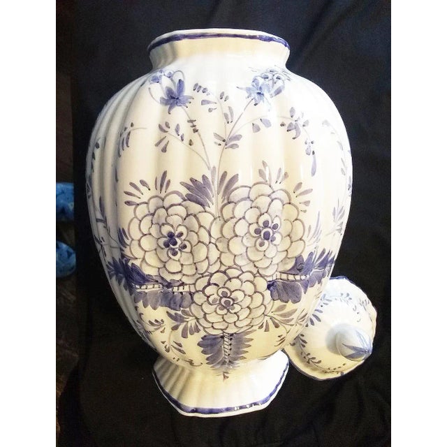 This Vintage Italian Vase/Urn is hand-painted in blue on a white field to depict floral and foliate designs all around the...