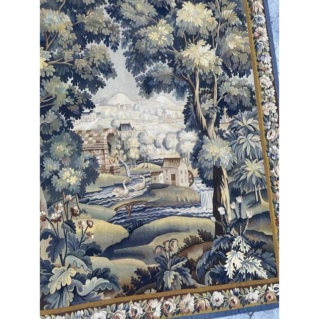 Early 20th Century Aubusson Tapestry – Pastoral Landscape with Floral Border A beautiful Aubusson tapestry featuring a...