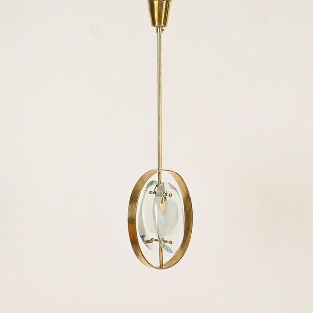 Striking pendant light model 1933 in the marvelous aquamarine glass version, designed by max ingrand and produced by...