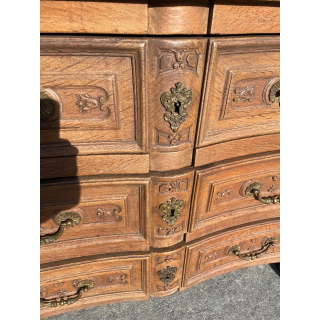This is an impressive 3 draw chest with deep carvings in rectangles on the drawer fronts and down the corner posts mostly...