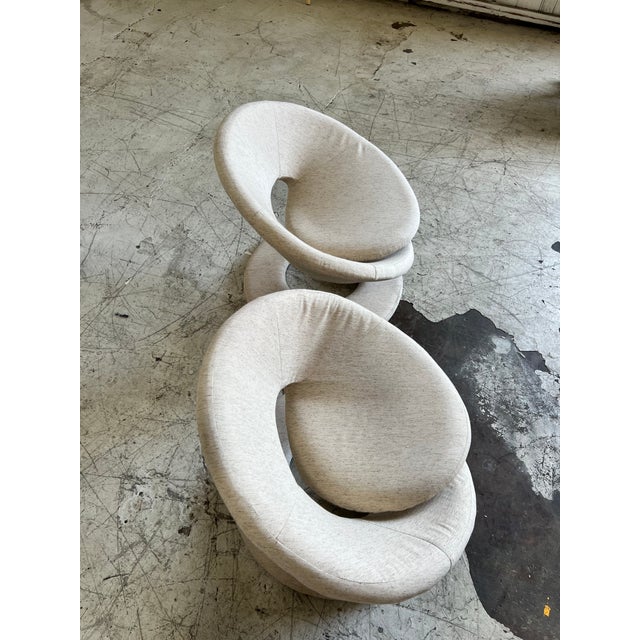 Vintage pair of spiral postmodern lounge chairs, newly upholstered in a natural beige woven fabric. In excellent vintage...
