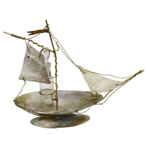 Antique shell figural ship watch holder with scent bottle. Would have been purchased as a souvenir in a seaside resort,...