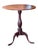 A well-proportioned oval tilt-top table on a turned baluster pedestal with a good warm patina. The top tilts on a brass...