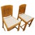 An elegant pair of British Art Deco side chairs, dating to circa 1930, beautifully crafted in oak and distinguished by...