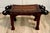 Here is a wonderfully sculptural vintage Indian bench, hand-carved from solid hardwood and featuring four dramatic...