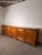 An impressive wooden sideboard with a warm honey-brown finish and a generous length of 350 cm. Its classic design features...