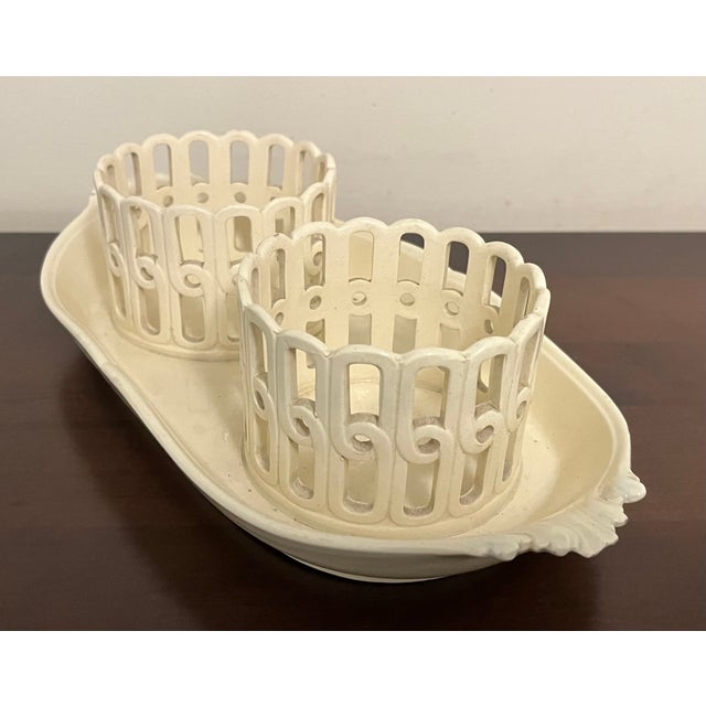 Antique 18th century French creamware cruet bottle stand. Boat shaped tray with fine foliate handles and two pierced or...