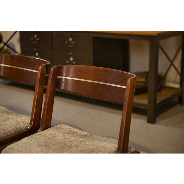 Set of four Scandinavian chairs from the 1960s, with a clean and well-balanced design. The frame is made of solid wood...