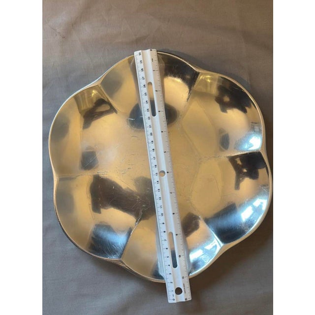 The Nambé Platter #602, crafted from Nambé's proprietary metal alloy which gives it a bright, silver-like luster. The...