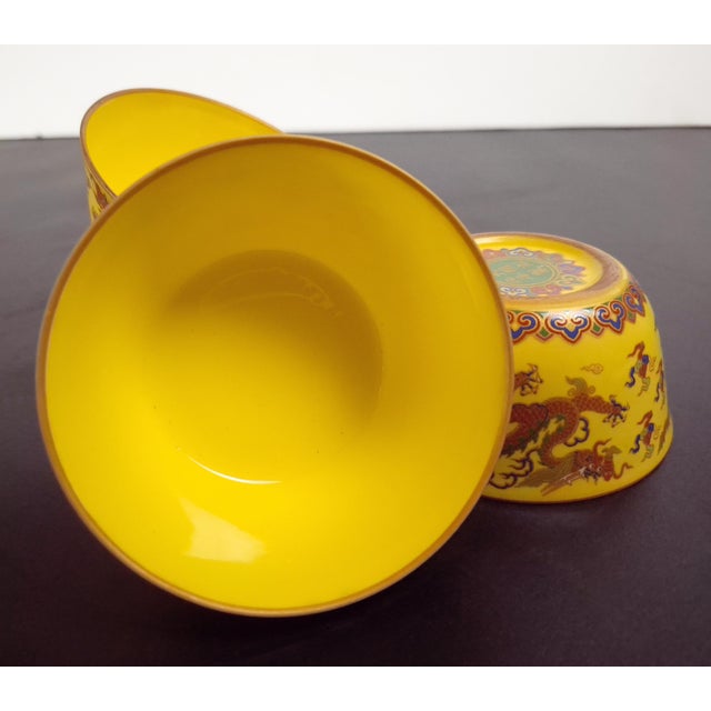 Set of four Chinese porcelain dragon cups, a finely formed and potted, matching set of four teacups with an imperial...