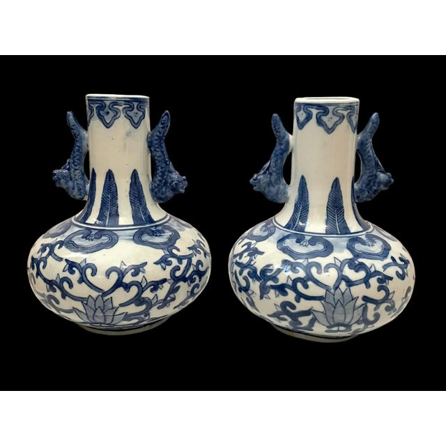 This beautiful pair of blue and white porcelain vase jars with intricately designed Foo dogs is a must-have for any...