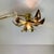 Beautiful wall or ceiling lamp in gold metal with two flowers. Designed by willy daro in the 70’s and produced until the...