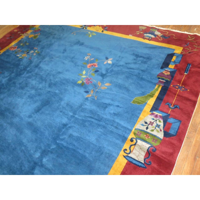 Full pile large Chinese Art Deco rug plum border, blue field Measures: 10' x 19'1".