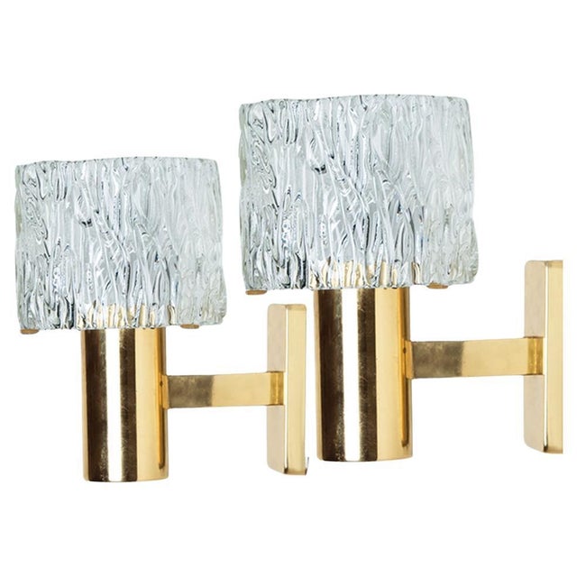 1 of the 2 pairs high-end wall lights with a glass shade and brass frame. The light fixtures are produced in the 1960s and...