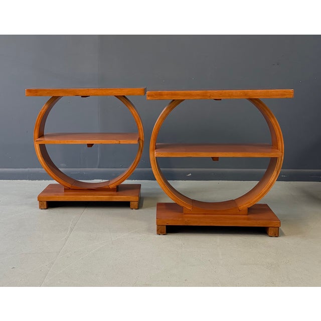 A striking pair of Art Deco side tables by A. A. Laun Furniture Co. of Kiel, Wisconsin, showcasing the refined geometry...