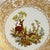 Vintage wildlife plate depicting and Deer and her Fawns on the inset of a white porcelain plate with ornate gold...