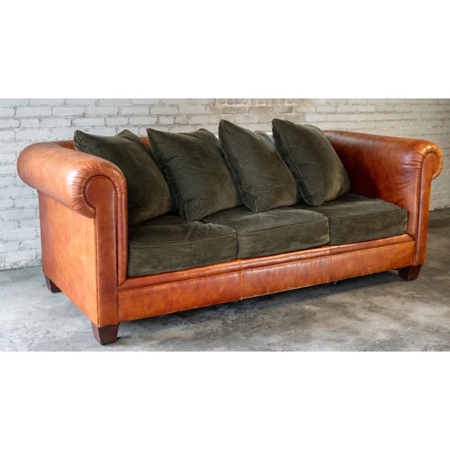 Ralph Lauren Chesterfield Leather and Green Corduroy Three-Seater Sofa, circa 2000s. Rich, vibrant cognac leather wraps...