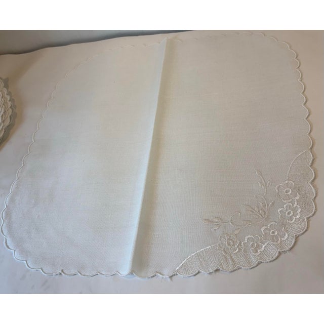 Nice set of six dinner napkins with embroidered corners